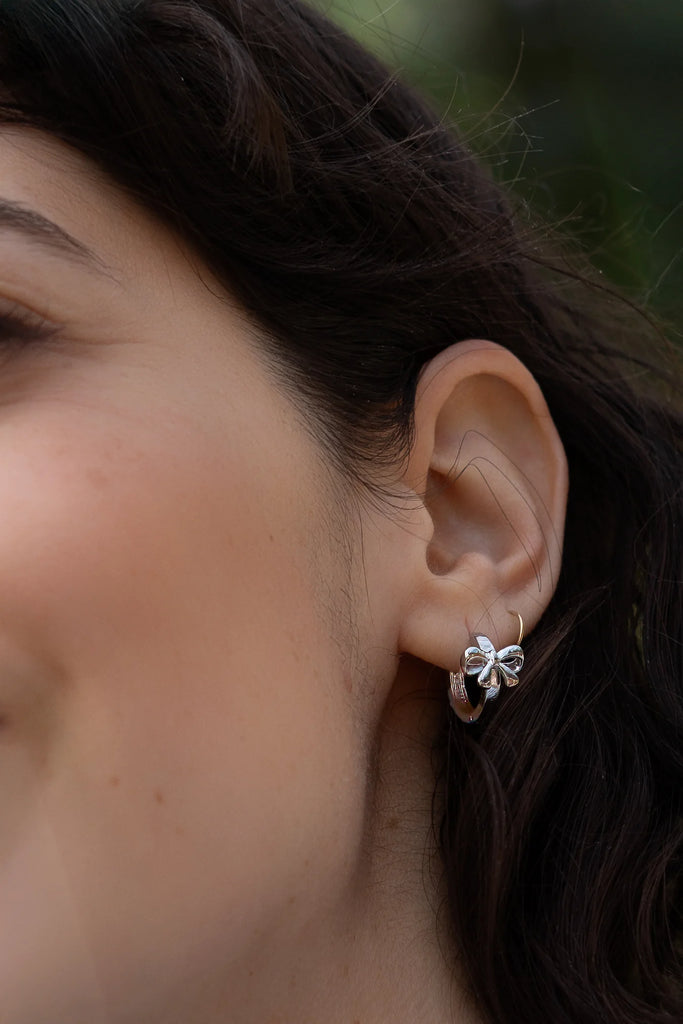 Peter + June Silver Bow and Tell Huggie Hoop Earrings - Silver Jewelry