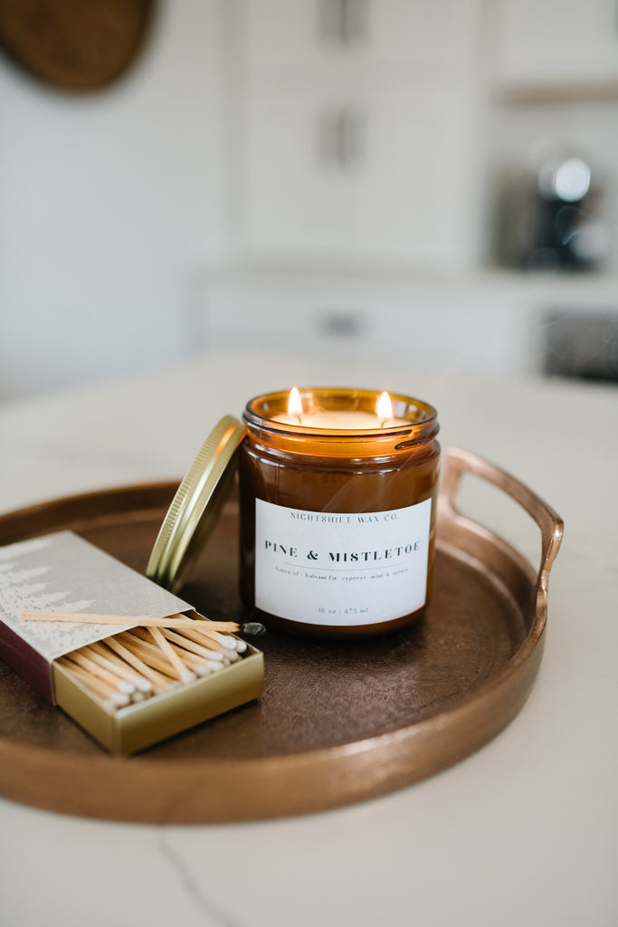 Natural candle and a box of matches arranged on a countertop - Terra Shepherd - Sustainable and natural home and lifestyle products including decor, candles, cleaning supplies, books, tea, and more.